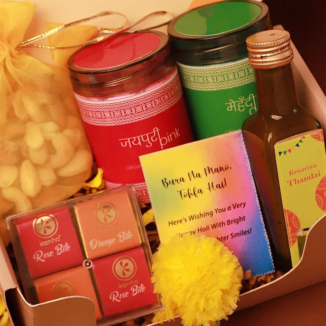 Blissful Holi Gift Box | Includes 2 Organic Color Jars, 1 Mix Nuts Potli, 4 Rose & Orange Bites in Acrylic Box, 1 Thandai, 1 Faux Marigold Flower, 1 Holi Card, 1 Corrugated Gift Box