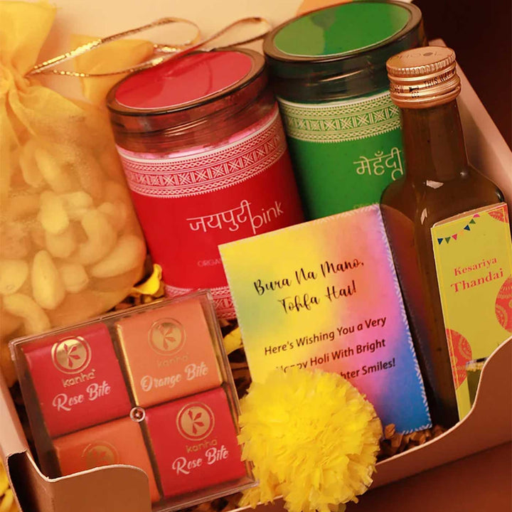 Blissful Holi Gift Box | Includes 2 Organic Color Jars, 1 Mix Nuts Potli, 4 Rose & Orange Bites in Acrylic Box, 1 Thandai, 1 Faux Marigold Flower, 1 Holi Card, 1 Corrugated Gift Box