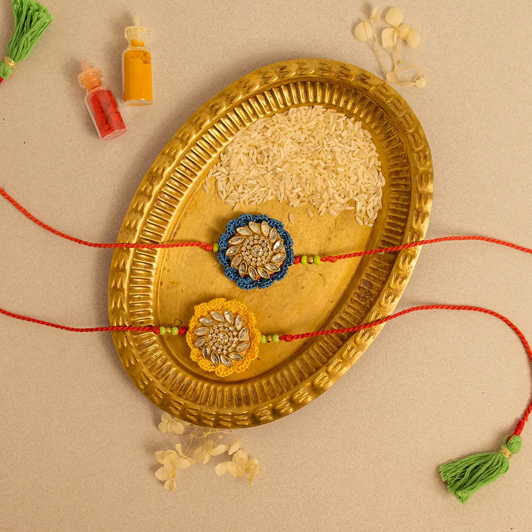 Handmade Crochet Blue And Yellow Kundan Rakhi With Roli Chawal Set Of 2 - Alternate Side Arrangement Display