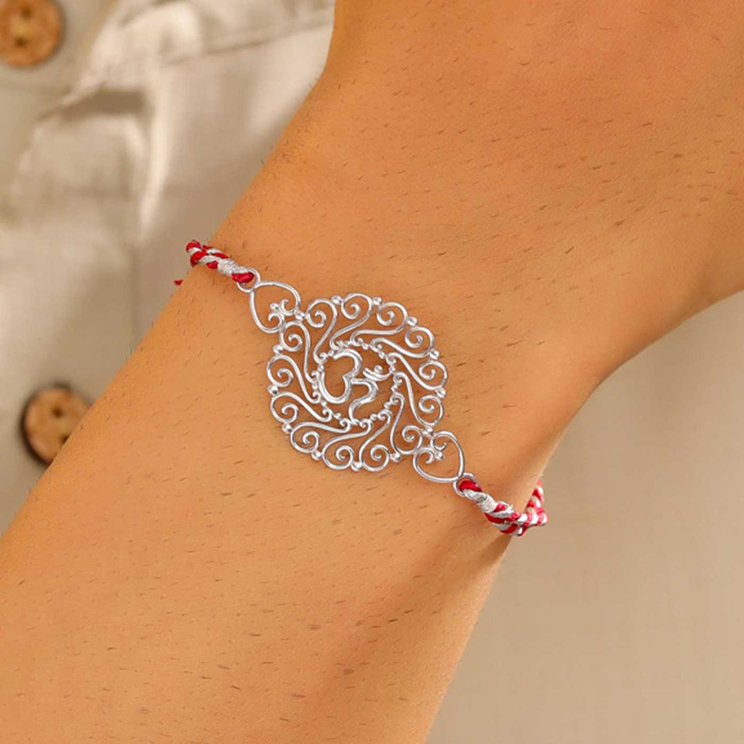 Handmade Om Design Religious Silver Rakhi For Brother - On Wrist Model