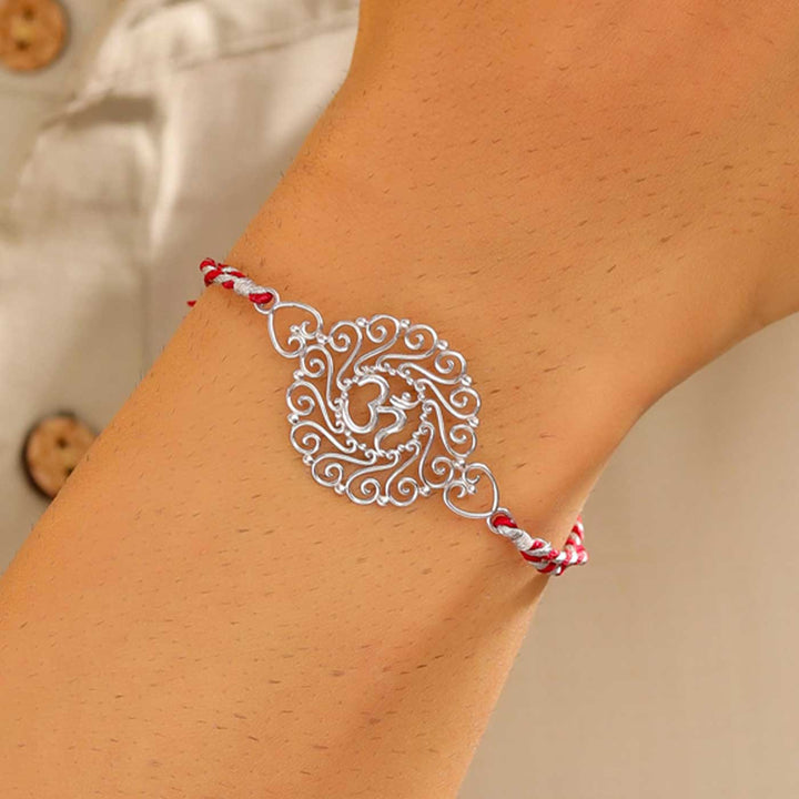 Handmade Om Design Religious Silver Rakhi For Brother - On Wrist Model