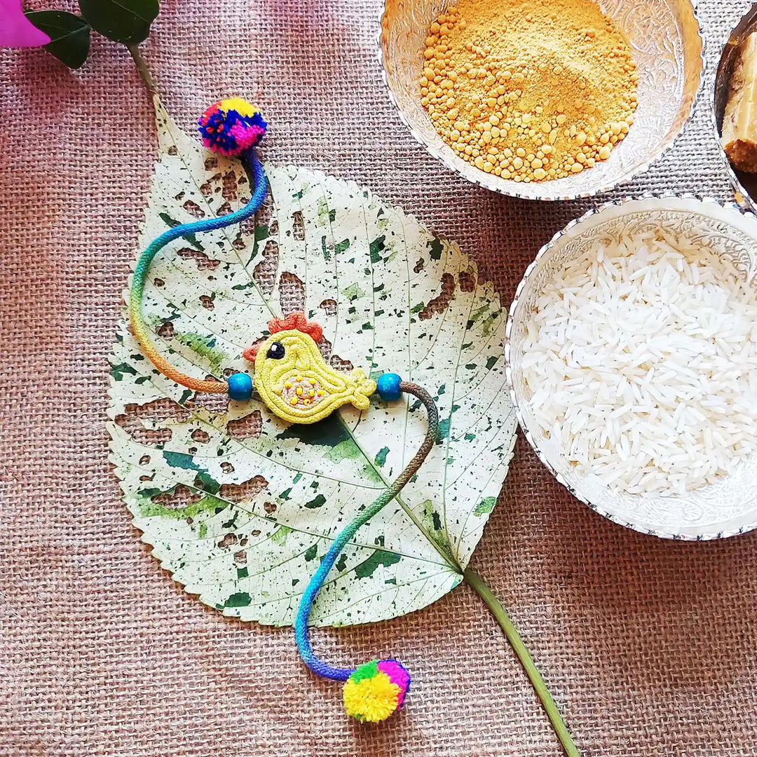 Handmade Dori Work Cute Chick Kids Rakhi With Roli Chawal - Styled with Decorative Elements