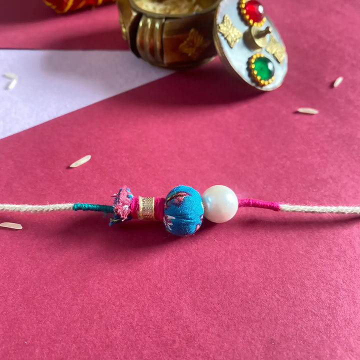 Handmade Ecofriendly Jhoomar Pearl Rakhi With Roli Chawal