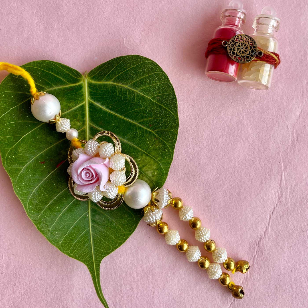Handmade Purple Flower Design Pearl And Stone Bhaiya Bhabhi Rakhi - Side Angle Full View