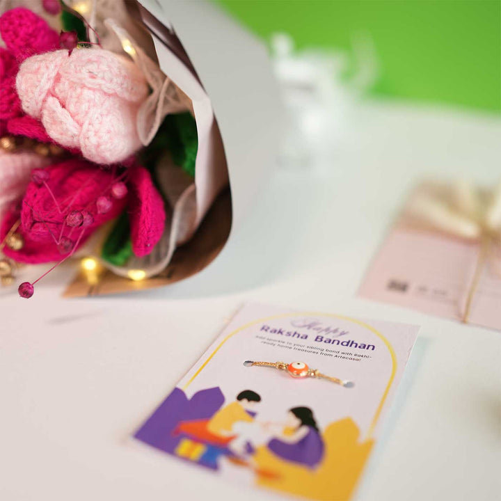 Personalized Handmade Crochet Pretty Pansy Rakhi Hamper Includes 1 Crochet Flower Bunch 1 Message Card And 1 Rakhi And Roli Chawal - Close-up of Rakhi with Bouquet
