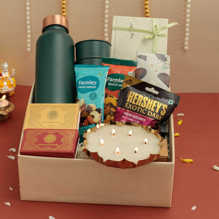 Handmade Umang Gift Hamper | Includes 1 Bottle, 2 Glasses, 1 Chocolate, 1 Chocolate Bar, 2 Dry Fruit, 1 Diary, 1 Candle, 1 X Roli Chawal, 1 Pooja Set,1 Card And 1Box