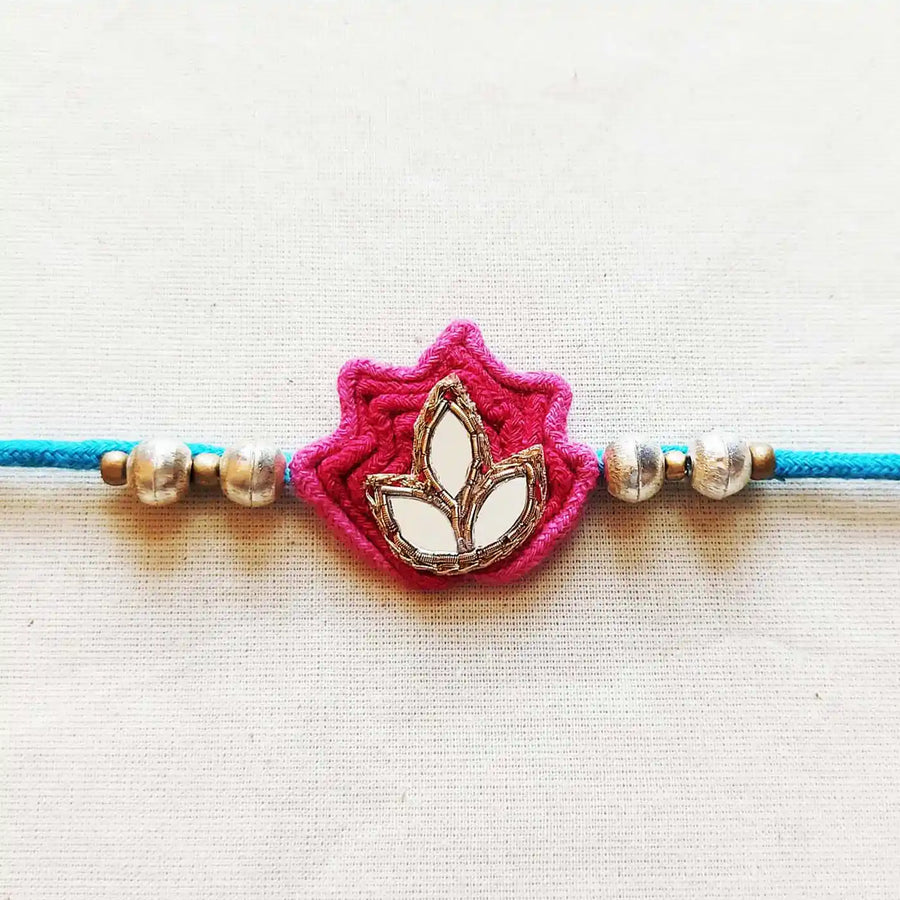 Handmade Mirror Work Lotus Rakhi With Roli Chawal - Close-up of Lotus Motif