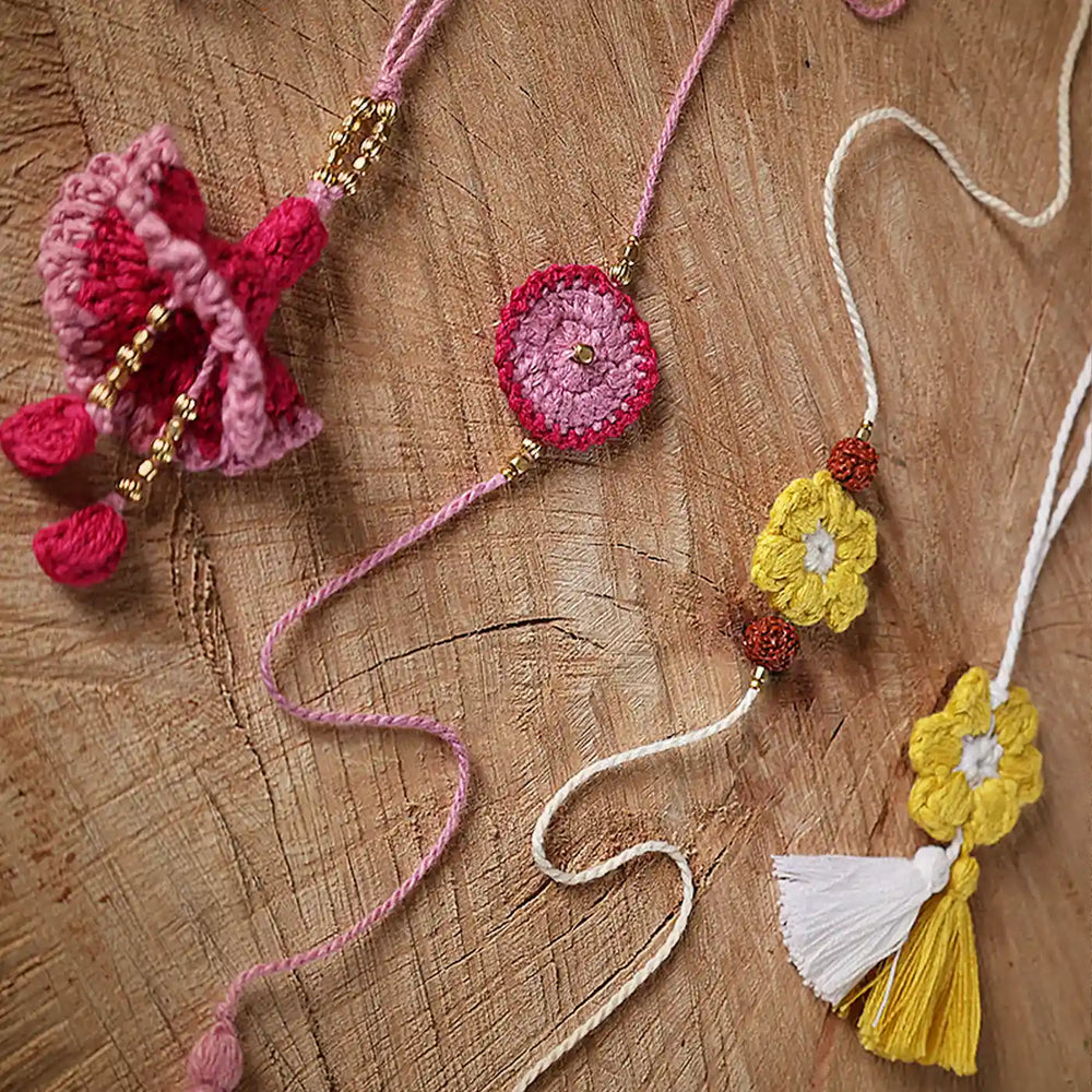 Handmade Crochet Pink And Yellow Bhaiya Bhabhi Rakhi With Roli Chawal Set Of 4 - Close-up View Showing Details