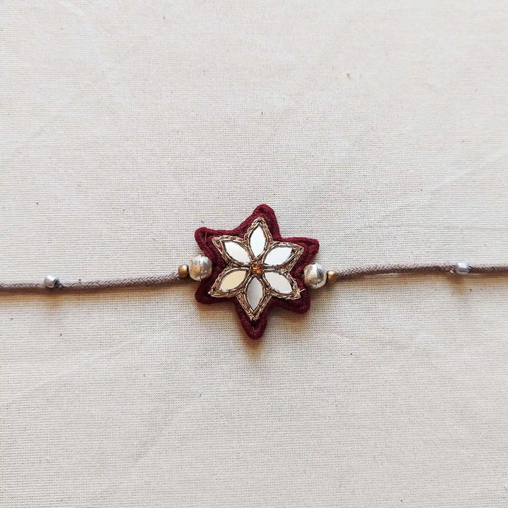 Handmade Mirror Work Flower Rakhi With Roli Chawal - Close-up Front View (13)