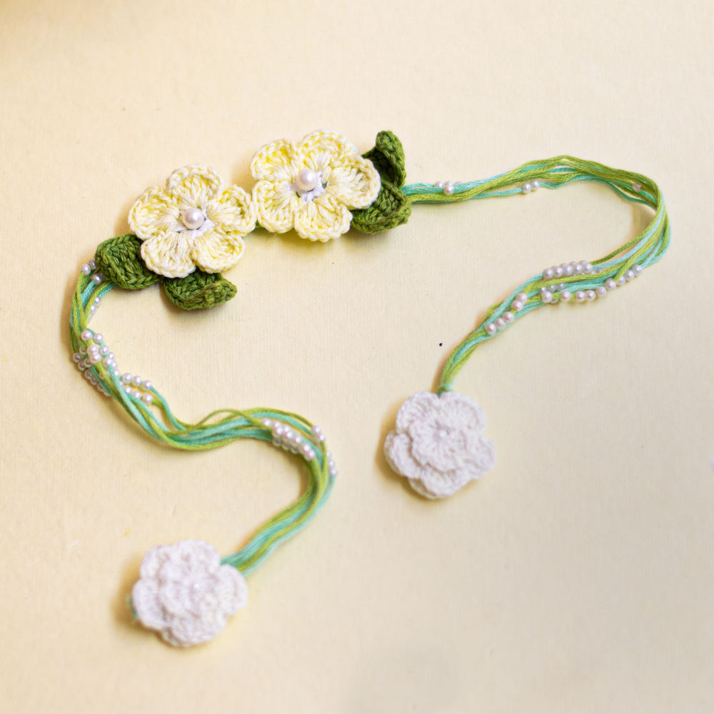 Handmade Reusable White Floral Bliss Bhaiya Bhabhi Rakhi With Roli Chawal - Single Floral Necklace Laid Flat
