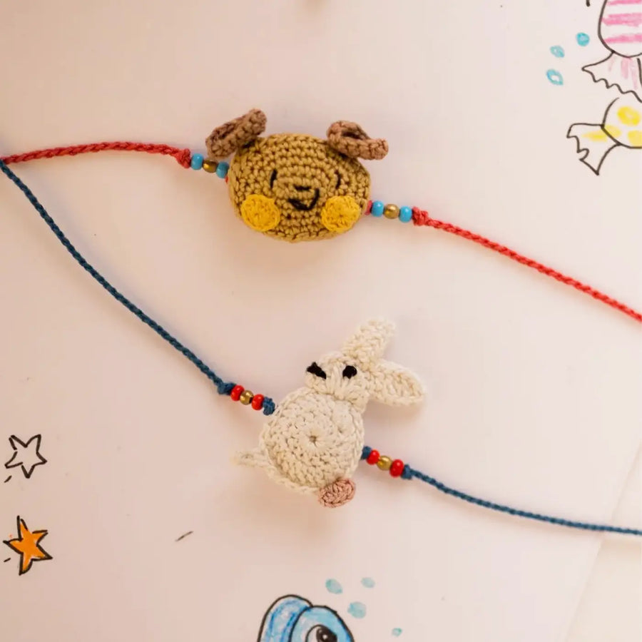 Handmade Crochet Bear And Rabbit Theme Kids Rakhi With Roli Chawal Set Of 2 - Close-up of Crochet Animal Bracelets