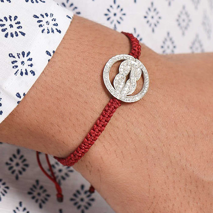 Handmade Knot Design Silver Rakhi For Brother - Model Wearing Bracelet