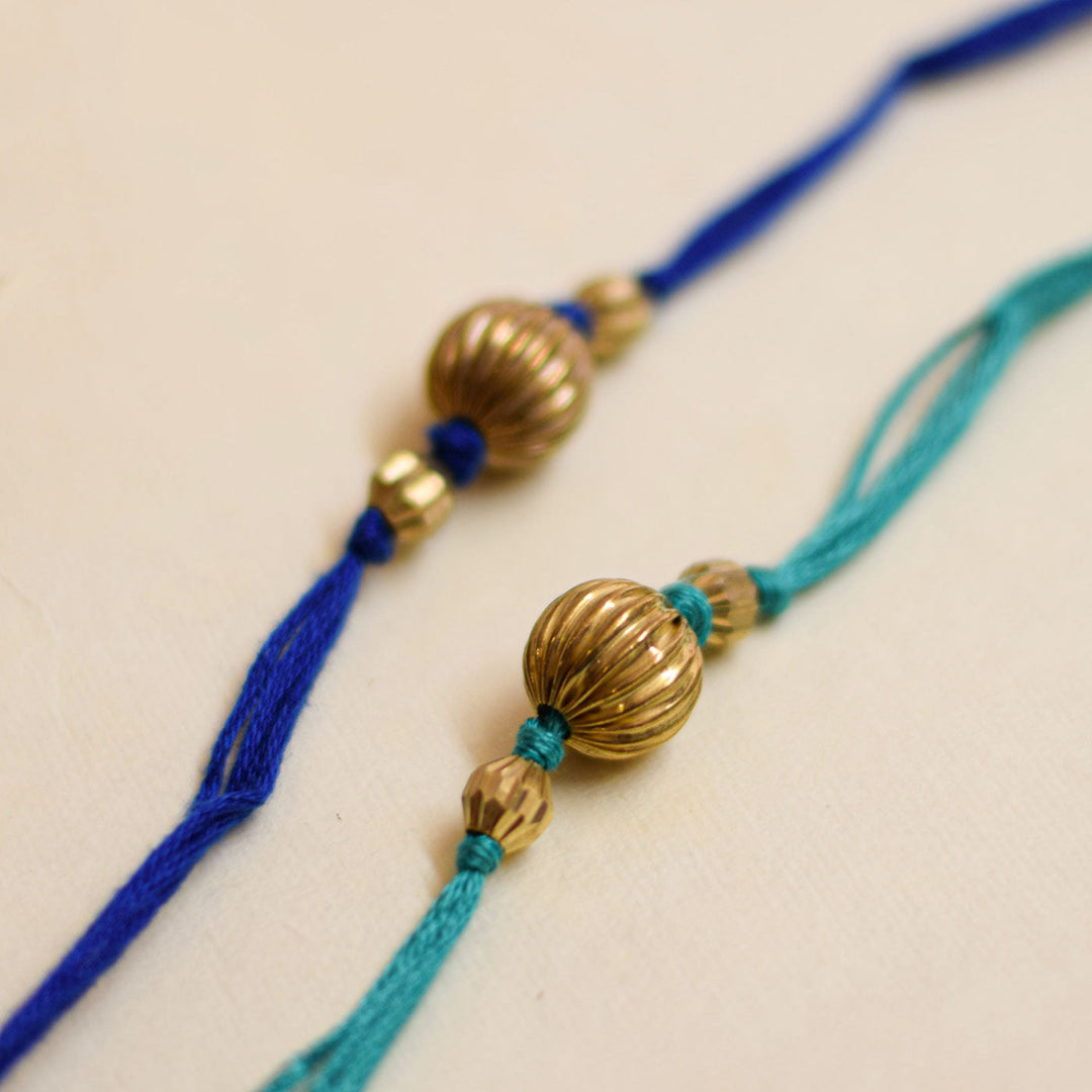 Handmade Swarn Pearl And Ghungroo Rakhi With Roli Chawal - Top view showing bead details