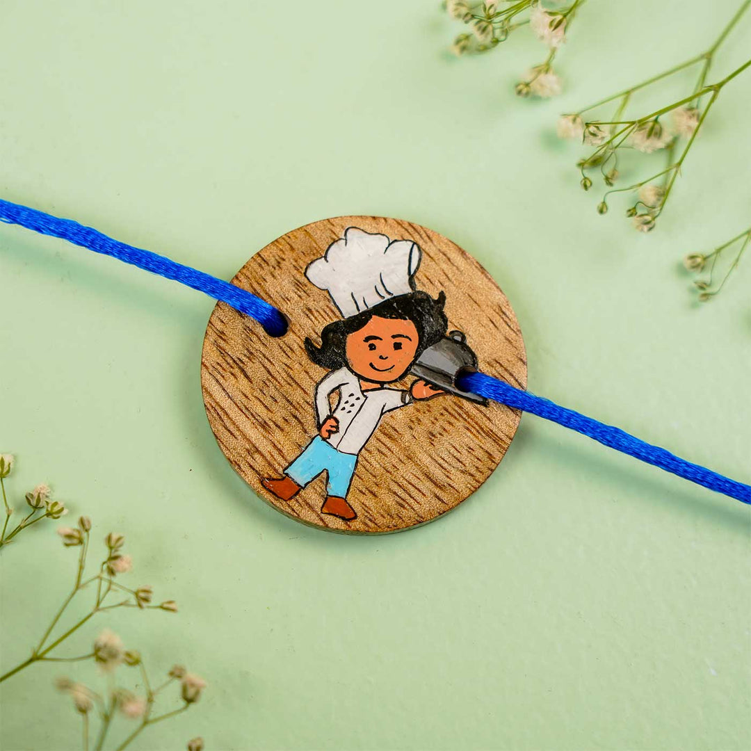 Personalized Hand Painted Chef Theme Wooden Rakhi With Roli Chawal - Close-up of Wooden Medallion