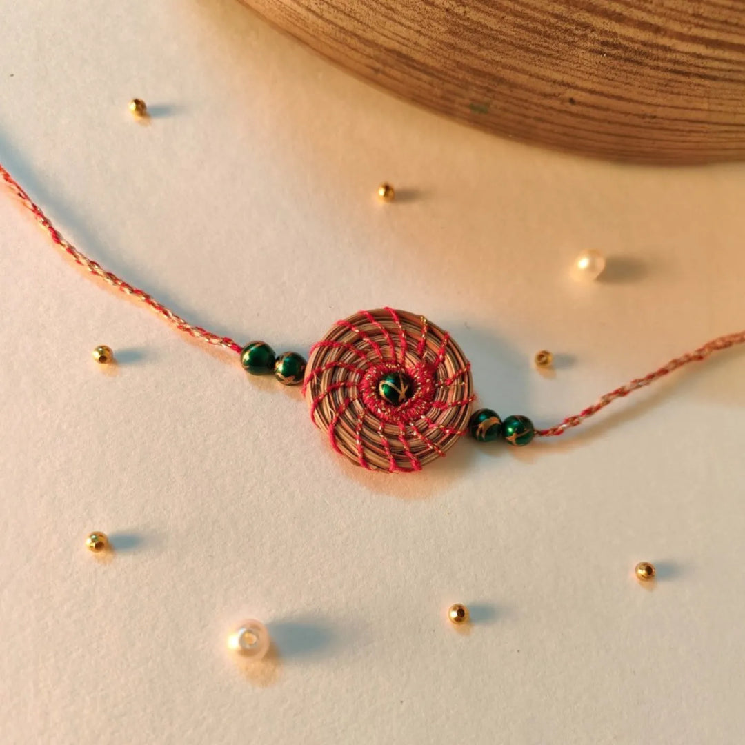 Eco Friendly Handmade Green Breads Pine Needle Rakhi With Pouch And Roli Chawal - Styled with Decorative Beads