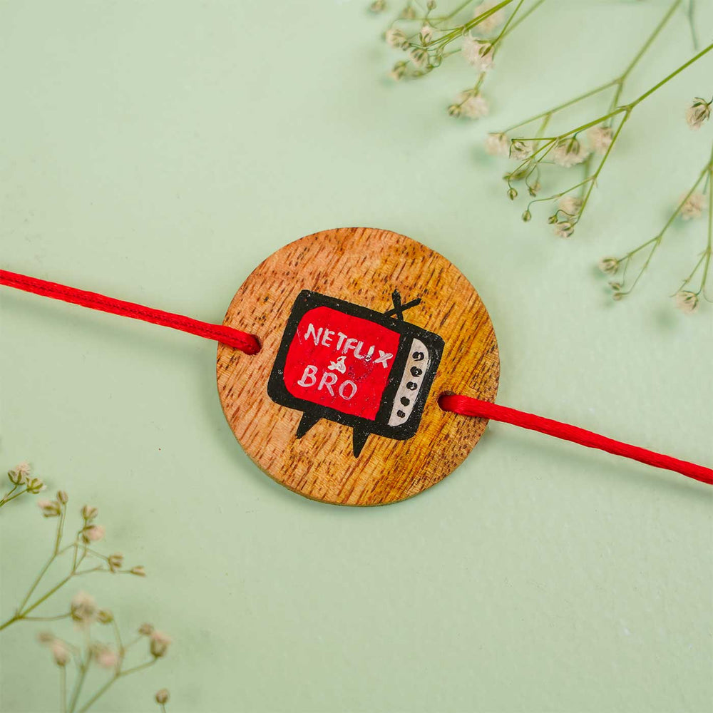 Personalized Hand Painted Netflix Bro Wooden Rakhi With Roli Chawal - Close-up on Flat Surface