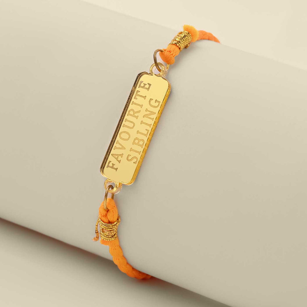 Handmade Favoirite Sibling Design Acrylic Rakhi - Angled View on Display Stand
