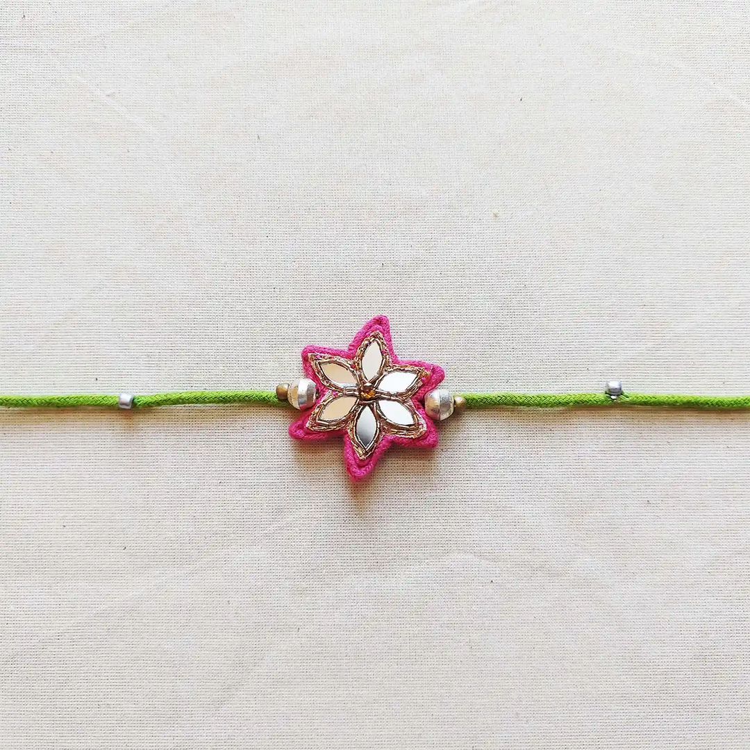 Handmade Mirror Work Flower Rakhi With Roli Chawal - Close-up Front View (4)