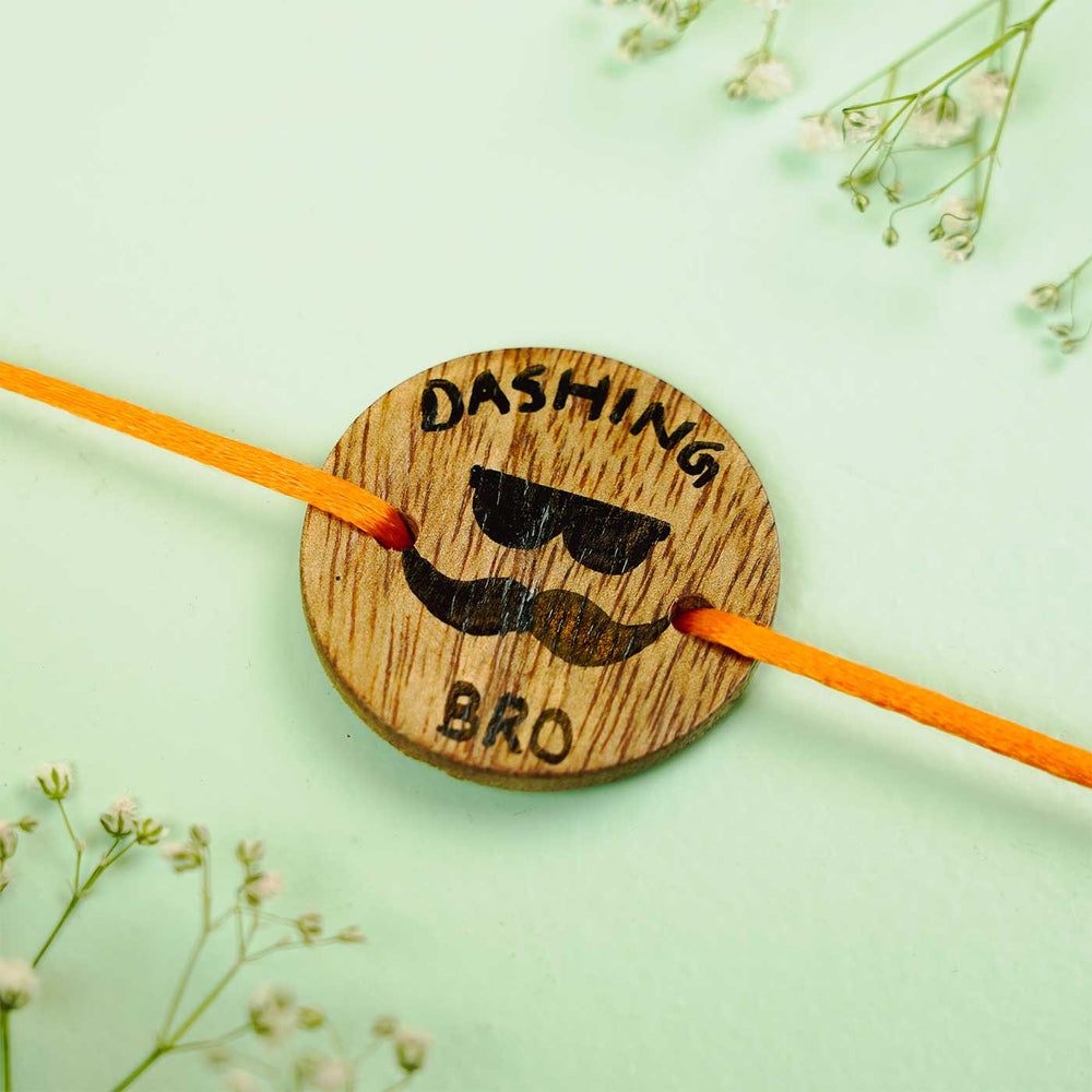 Personalized Hand Painted Dashing Bro Wooden Rakhi With Roli Chawal - Close-up of Wooden Charm