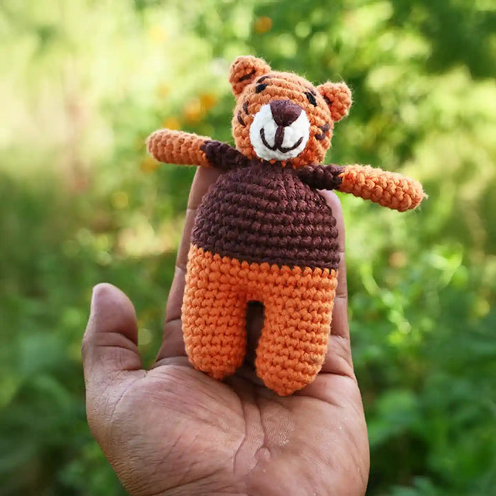 Handmade Crochet Tiger Theme Kids Rakhi And Toy Combo With Roli Chawal Set Of 2 - Size Scale in Hand