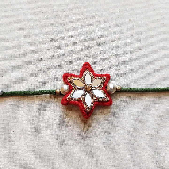 Handmade Mirror Work Flower Rakhi With Roli Chawal - Close-up Front View