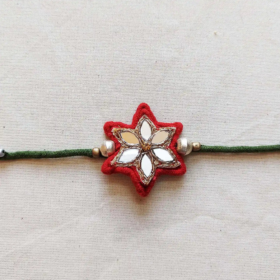 Handmade Mirror Work Flower Rakhi With Roli Chawal - Close-up Front View
