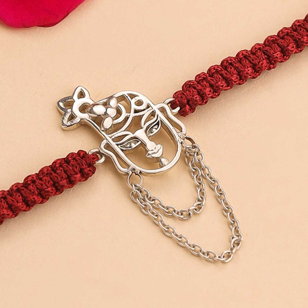 Handmade Krishna Design Religious Silver Rakhi For Brother - Close-up of Metal Charm