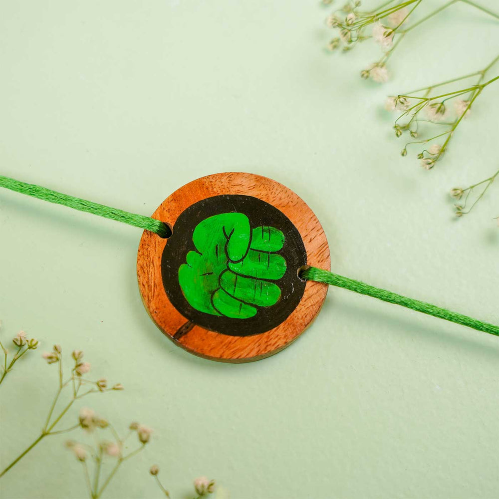 Personalized Hand Painted Hulk Theme Wooden Rakhi With Roli Chawal - Close-up of Bracelet with Flowers