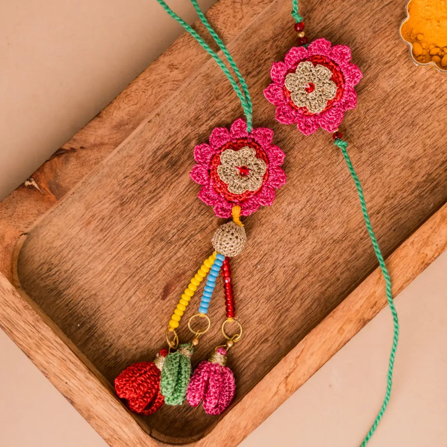 Handmade Crochet Pink Bougainvillea Bhaiya Bhabhi Rakhi With Roli Chawal Set Of 2 - Close-up of Crochet Flower Pendant