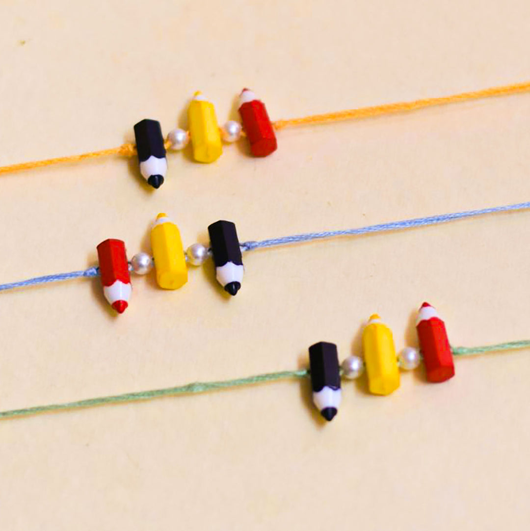 Handmade Pencil Andpearl Design Kids Rakhi With Roli Chawal - Grouped Set Close-up View