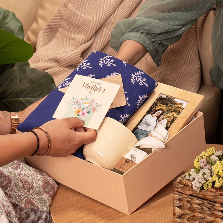 Photo Personalized For the Heart of Our Home Gift Hamper | Includes 1 Hand Block Printed Saree with Unstitched Blouse, 1 Wooden Photo Frame, 1 Ribbed & Glazed Ceramic Mug, 1 Coconut Oil, 1 Mother’s Day Handwritten Postcard, 1 Classic Gift Box
