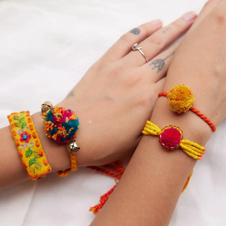 4 pc Rakhi + Brass Thali Set | Premium Zoey Beads & Pom Pom Rakhi Set with Roli Chawal