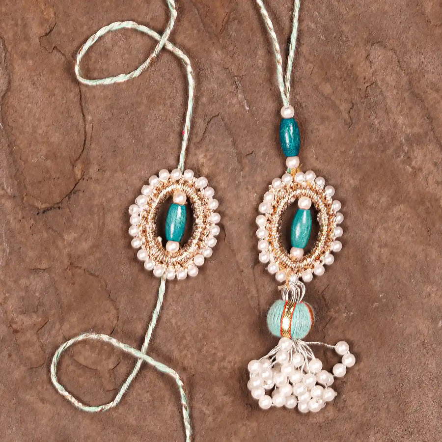Handmade Beaded Subh Moti Bhaiya Bhabhi Rakhi With Roli Chawal Set Of 2 - Flat Lay Close-up