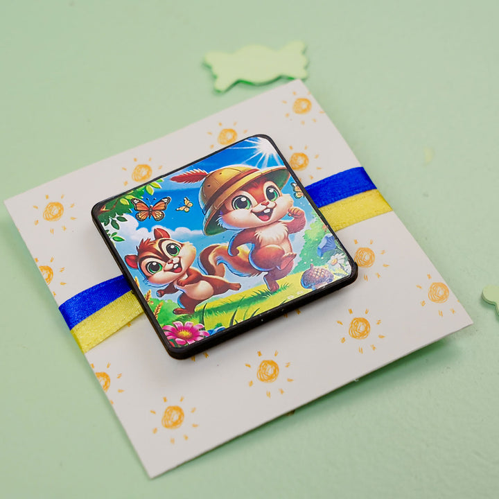 Squirrel Twins Reusable Mdf Wood Rakhi With Roli Chawal For Siblings - Angled Front View on Card