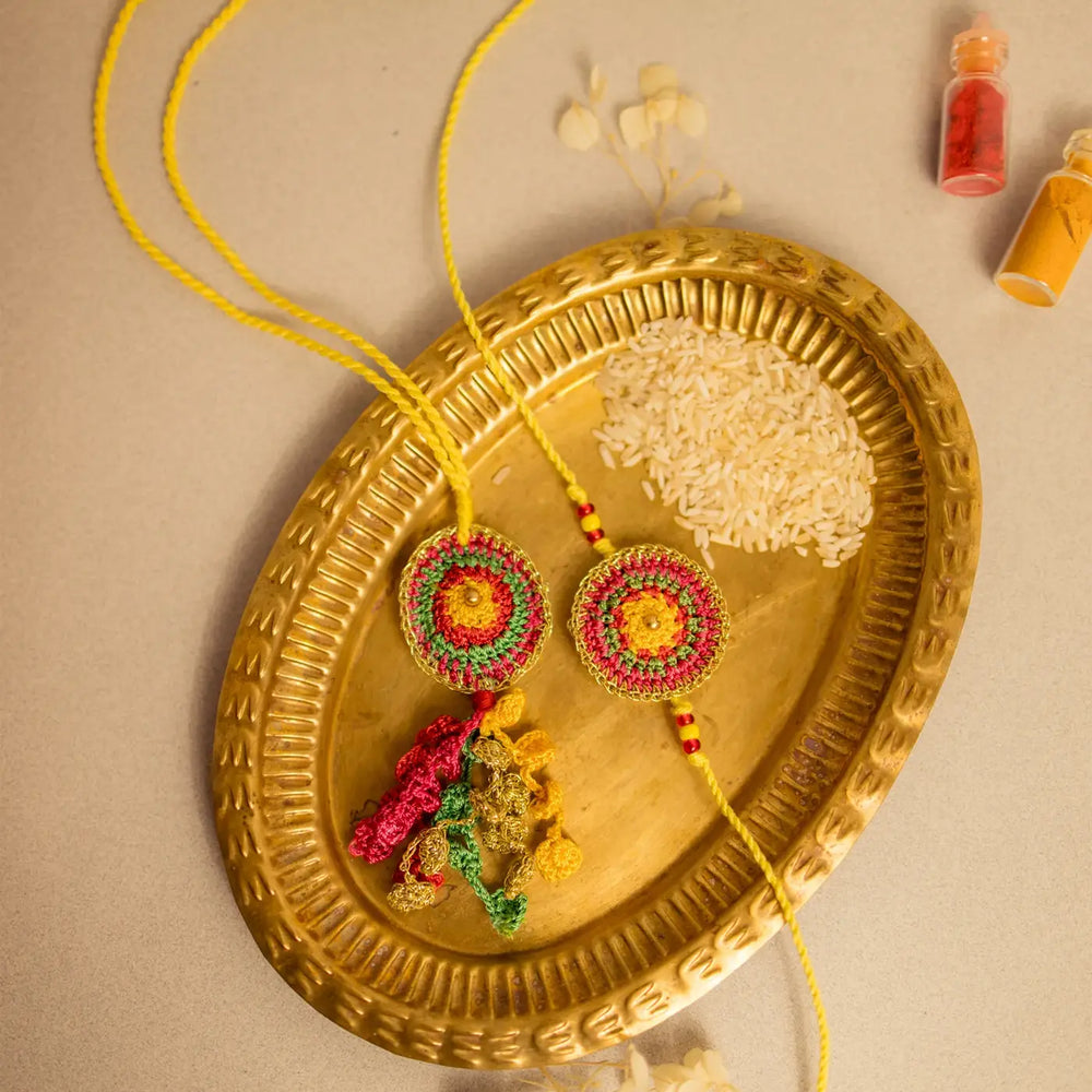 Handmade Crochet Rangeeli Bel Bhaiya Bhabhi Rakhi With Roli Chawal Set Of 2 - Decorative Arrangement on Brass Plate