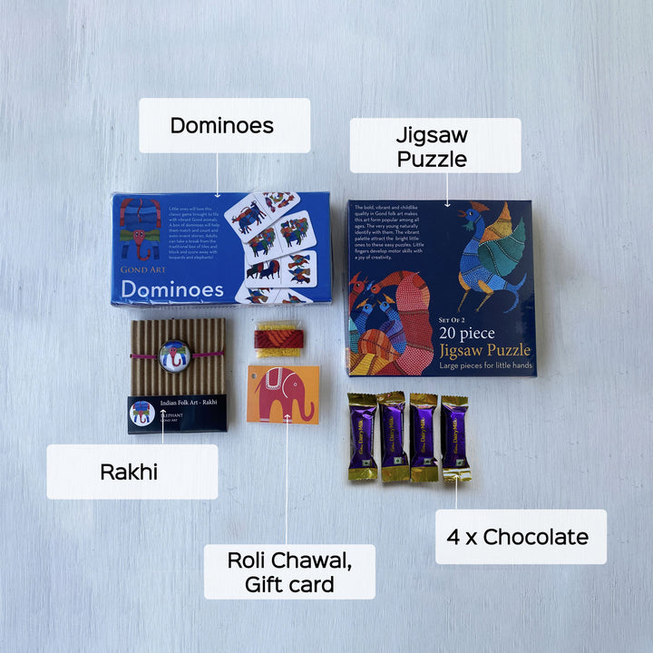 Handcrafted Folk Art Rakhi Hamper For Kids With Rice Roli Haldi 2 - Contents labelled flat lay