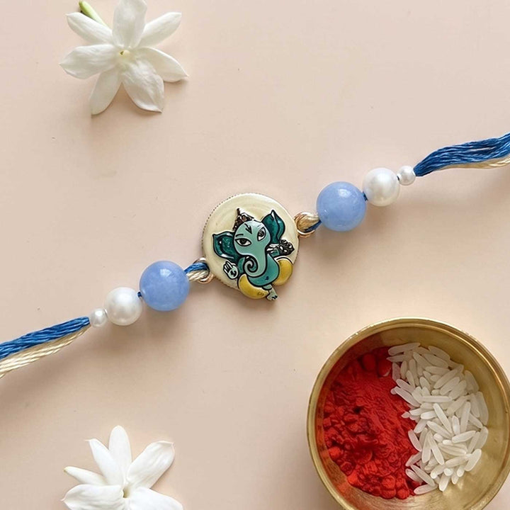 Engraved Lord Ganesha Enamel Metal Charm Rakhi With Roli Chawal for Brother