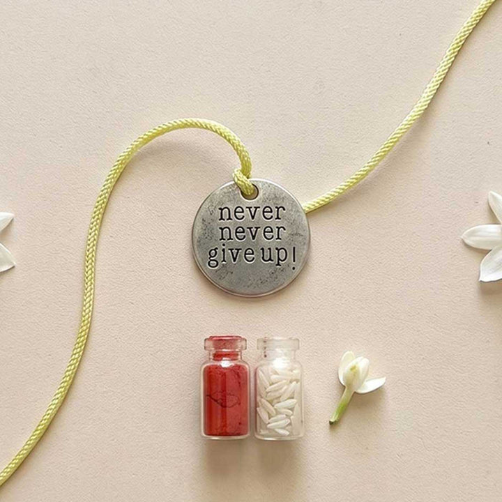 Engraved "Never Never Give Up" Quote Metal Charm Rakhi With Roli Chawal for Brother