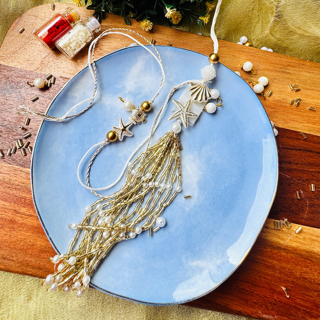 Handmade Sea Shell Charm Moti Bead & Thread Rakhi With Lumba With Roli Chawal For Bhaiya Bhabhi | Set Of 2