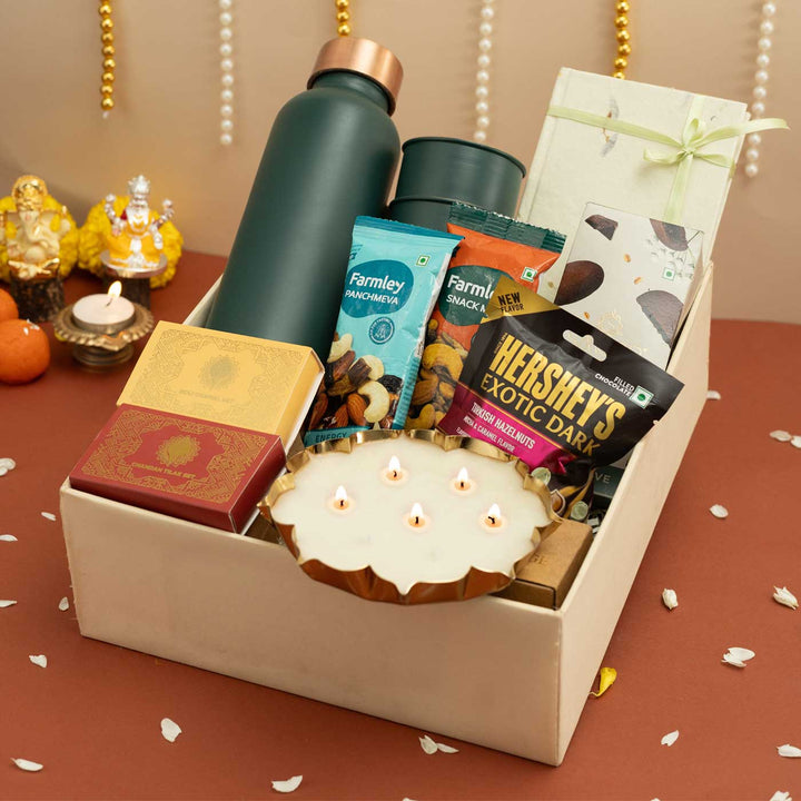 Handmade Umang Gift Hamper | Includes 1 Bottle, 2 Glasses, 1 Chocolate, 1 Chocolate Bar, 2 Dry Fruit, 1 Diary, 1 Candle, 1 X Roli Chawal, 1 Pooja Set,1 Card And 1Box