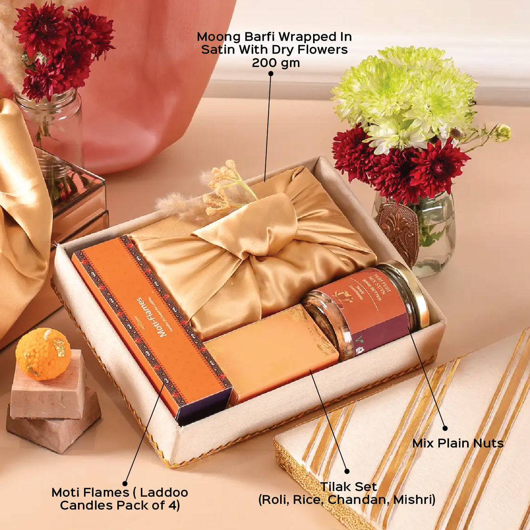 Exquisite Diwali Delights Gift Hamper | Includes 4 Laddoo Candles, 1 Moong Barfi Box, 1 Mix Nuts Jar, 1 Tilak Set, 1 Gift Box