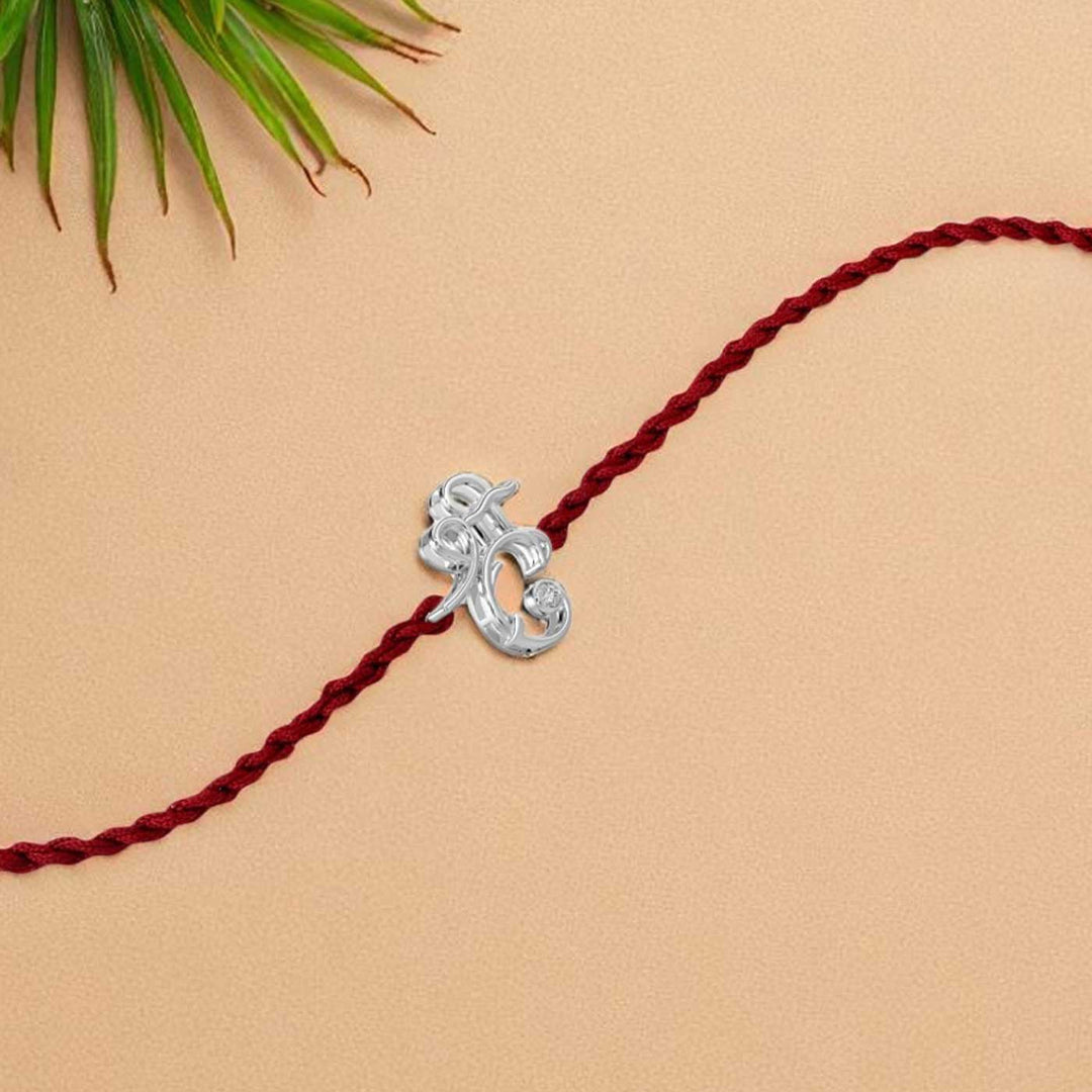 Handmade Shri Design Religious Silver Rakhi For Brother - Single Rakhi Display on Plain Background