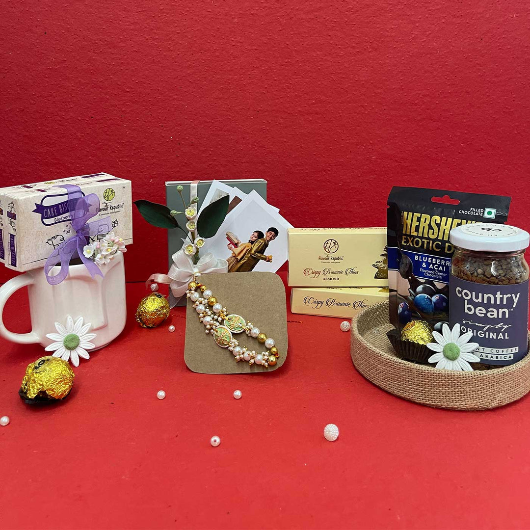 Photo Personalized Handmade Crumbs And Chaos Rakhi Hamper Includes 1 Mug 2 Biscotti 5 Photos 2 Brownies 1 Marble Lotus 1 Chocolate 1 Coffee And 1 Set Bhaiya Bhabhi Rakhi - Gift Items with Decorative Flowers