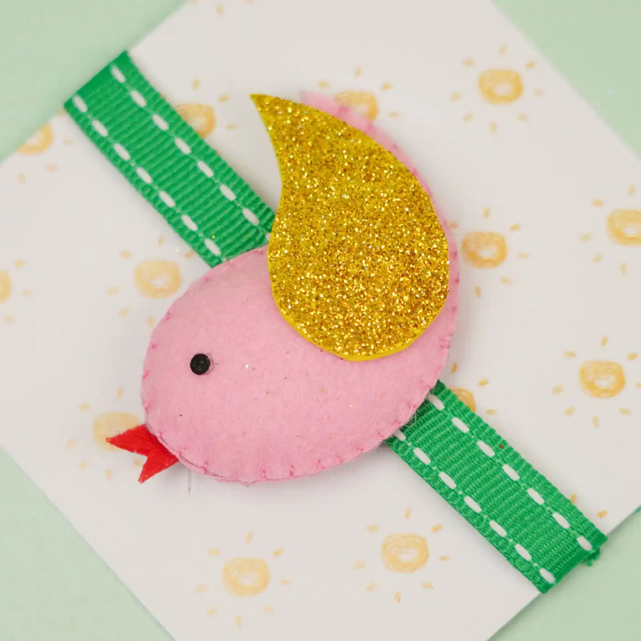 Handmade Bird Theme Felt Kids Rakhi With Roli Chawal - Close-up of pink bird accessory