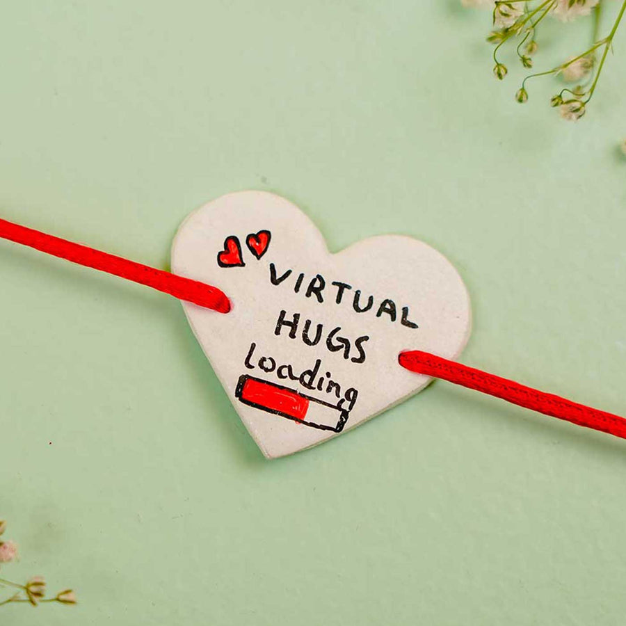 Personalized Hand Painted Virtual Hug Clay Rakhi With Roli Chawal - Close-up of heart charm bracelet