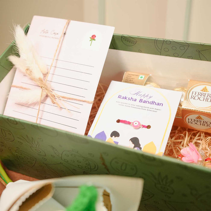 Personalized Handmade Crochet Flower Lover Rakhi Hamper Includes 1 Gift Box 1 Crochet Flower 1 Rakhis 1 Roli Chawal 1 Candle And 1 Message Card - Close-up of Card and Rakhi
