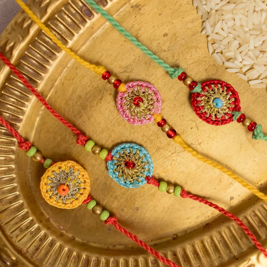 Handmade Crochet Multicolour Koi Rakhi With Roli Chawal Set Of 4 - Close-up of rakhi details