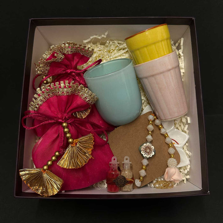 Handmade Riwaayat Duo Rakhi Hamper Includes 1 Marble Lotus 2 Kulhads 1 Candle 1 Kum Kum Chawal 1 Dry Fruit Potli And 1 Set Bhaiya Bhabhi Rakhi - Packed Gift Box View