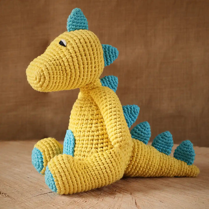 Handmade Crochet Baby Dragon Theme Kids Rakhi And Toy Combo With Roli Chawal Set Of 2 - Side View of Dinosaur Plush