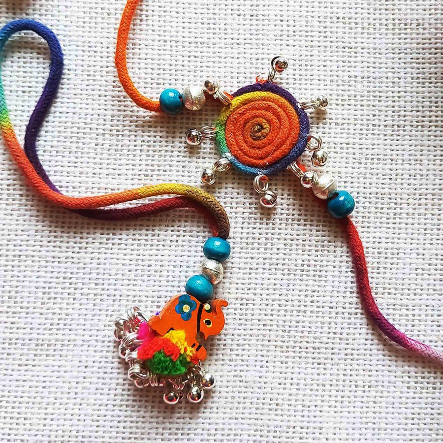Handmade Dori Work Elephant And Ghungroo Bhaiya Bhabhi Rakhi With Roli Chawal Set Of 2 - Close-up of decorations and beads